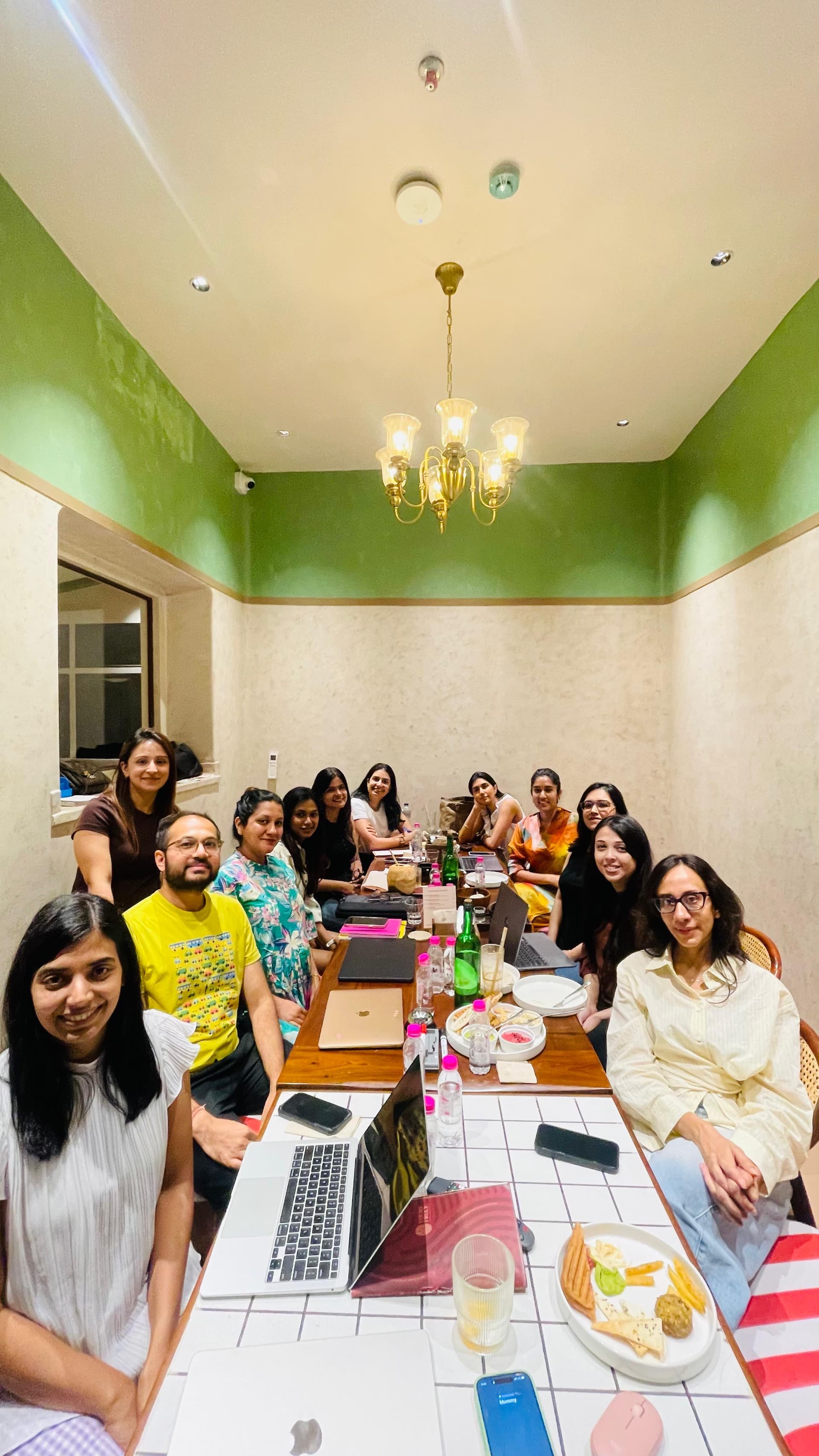 The full cohort around the table at the end of an open session