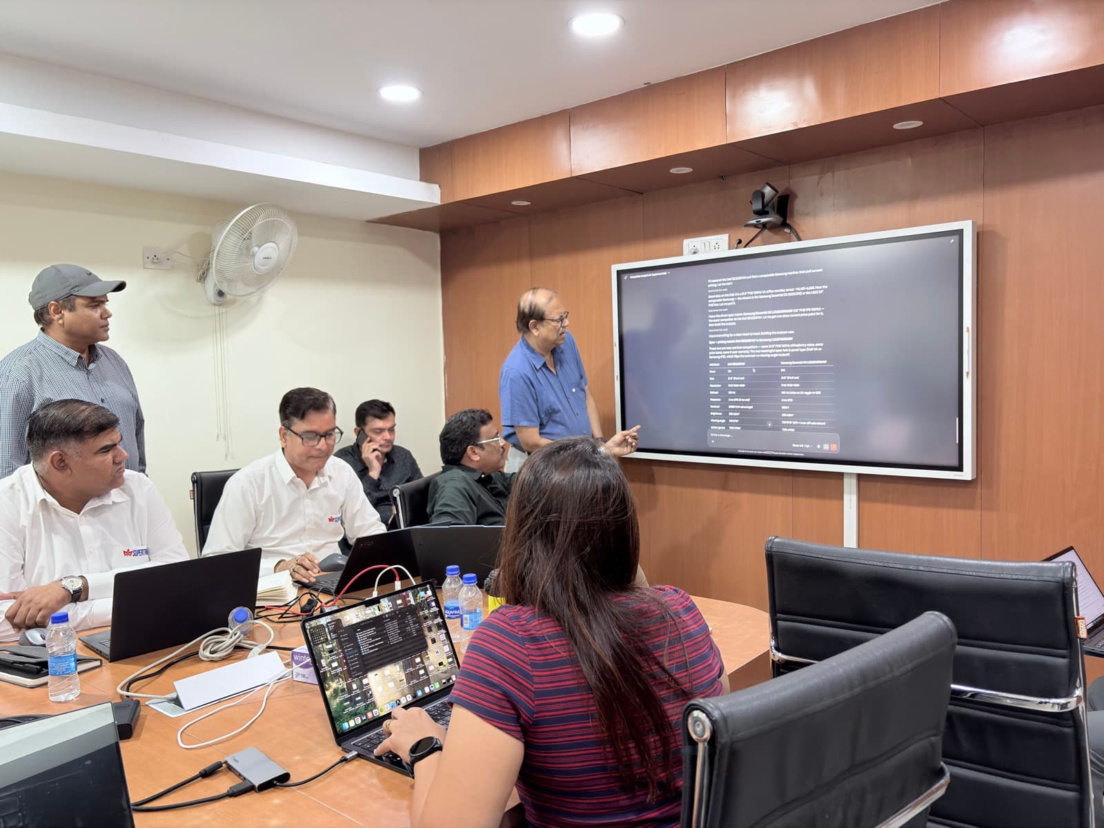 The Supertron sales team comparing product specifications with AI on the big screen, Delhi