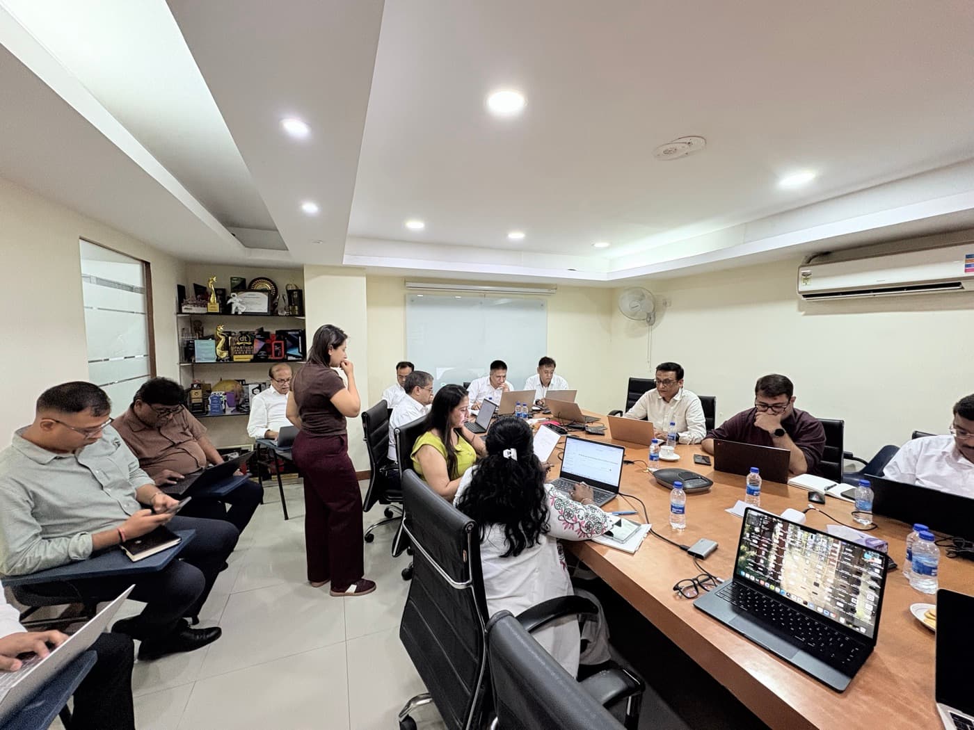 The Delhi session from the back of the boardroom, every seat taken
