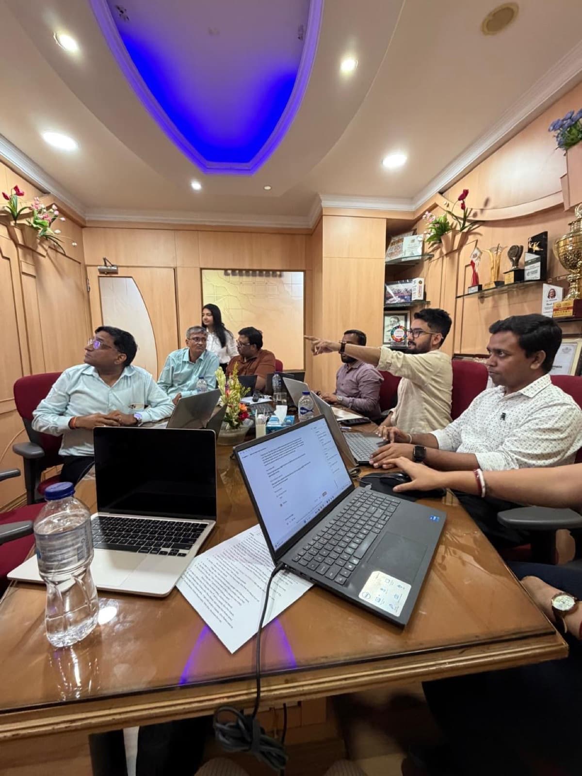 The Supertron India team following along on their laptops in Kolkata